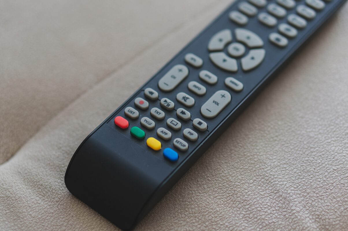 high angle shot of a remote control on a cream sof 2025 02 08 22 25 15 utc scaled